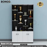 A black trophy cabinet with multiple shelves, filled with various trophies and awards.